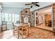 Bright sunroom features terra cotta tile flooring, brick accent wall, and large windows offering serene views at 2244 Deer Ridge Dr, Tucker, GA 30087