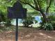 The Summit Swim and Tennis Club sign nestled among lush greenery, inviting residents to enjoy community amenities at 2244 Deer Ridge Dr, Tucker, GA 30087
