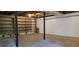 Spacious basement featuring shelving and black support beams ready for flexible use at 294 A Donald Rd, Canton, GA 30114