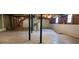 Unfinished basement with exposed ductwork, stairs, and natural light from the windows at 294 A Donald Rd, Canton, GA 30114