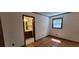 Bedroom with hardwood floors, one window and a doorway to an ensuite bathroom at 294 A Donald Rd, Canton, GA 30114