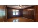 This bedroom is paneled with wood, features wood floors and a window for natural lighting at 294 A Donald Rd, Canton, GA 30114