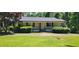 Single-story home with black shutters, landscaping, and a front porch at 294 A Donald Rd, Canton, GA 30114