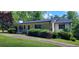 Charming single-story home featuring a welcoming front porch and lush landscaping at 294 A Donald Rd, Canton, GA 30114