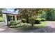Charming one-story home with vinyl siding, well-manicured landscaping, and a paved driveway at 294 A Donald Rd, Canton, GA 30114