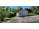 Detached one car garage with vinyl siding, green grass, and a paved driveway at 294 A Donald Rd, Canton, GA 30114