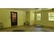 Spacious garage with windows for natural lighting and an exterior door at 294 A Donald Rd, Canton, GA 30114