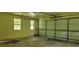 The garage features light yellow siding, a paneled garage door, and two windows at 294 A Donald Rd, Canton, GA 30114