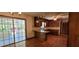 Eat-in kitchen features hardwood floors, stainless steel sink, breakfast bar and sliding door to the screen porch at 294 A Donald Rd, Canton, GA 30114