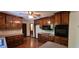The kitchen features wooden cabinets, a smooth cooktop, built in oven and microwave at 294 A Donald Rd, Canton, GA 30114