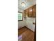 Laundry room features wood floors, overhead cabinets, one window and utility hookups at 294 A Donald Rd, Canton, GA 30114