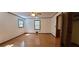 Spacious main bedroom showcases hardwood flooring and natural light from two windows at 294 A Donald Rd, Canton, GA 30114