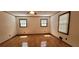 Light-filled main bedroom with gleaming hardwood floors and sunny windows at 294 A Donald Rd, Canton, GA 30114