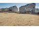 View of the home and large backyard showing ample space at 5015 Montes Ln, Cumming, GA 30040