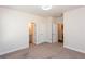 Bedroom with plush carpet and access to ensuite bathrooms at 5015 Montes Ln, Cumming, GA 30040