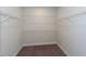 Walk-in closet with carpet flooring and white wire shelving on three walls for ample storage space at 5015 Montes Ln, Cumming, GA 30040