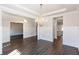 Bright open dining room with hardwood floors, chandelier, and view into the kitchen at 5015 Montes Ln, Cumming, GA 30040