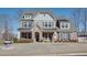 Beautiful two-story home with a brick and stone facade, complemented by a well-manicured lawn at 5015 Montes Ln, Cumming, GA 30040