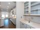 Modern kitchen featuring stainless steel appliances, hardwood flooring, and stylish backsplash at 5015 Montes Ln, Cumming, GA 30040