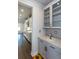 Modern kitchen featuring stainless steel appliances, hardwood flooring, and stylish backsplash at 5015 Montes Ln, Cumming, GA 30040