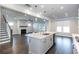 Gourmet kitchen with granite countertops, stainless steel appliances, and hardwood flooring at 5015 Montes Ln, Cumming, GA 30040