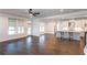 Bright and airy living area featuring a modern kitchen, hardwood floors and large windows at 5015 Montes Ln, Cumming, GA 30040