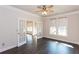 Bright and airy office space with French doors, a ceiling fan, and large windows at 5015 Montes Ln, Cumming, GA 30040