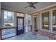 Screened sunroom with tile flooring, ceiling fan, and access to exterior at 5015 Montes Ln, Cumming, GA 30040