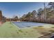 Well-maintained community tennis court with surrounding trees at 5015 Montes Ln, Cumming, GA 30040
