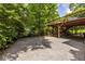 Gravel backyard patio and outdoor deck perfect for entertaining and relaxing at 588 Oakdale Ne Rd, Atlanta, GA 30307