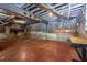 Spacious basement with exposed brick walls, high ceilings, and concrete floor at 588 Oakdale Ne Rd, Atlanta, GA 30307
