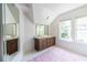 Bright bathroom with a double sink vanity, large mirrors, and two windows letting in natural light at 588 Oakdale Ne Rd, Atlanta, GA 30307