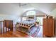 Open bedroom area with hardwood floors, a large window and vaulted ceilings at 588 Oakdale Ne Rd, Atlanta, GA 30307