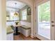 Breakfast nook with sunny windows, a table, banquette seating and access to the deck at 588 Oakdale Ne Rd, Atlanta, GA 30307