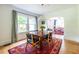 Dining room featuring a wooden table, hardwood floors and colorful area rug at 588 Oakdale Ne Rd, Atlanta, GA 30307
