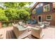 Exterior view of home with a large deck and outdoor seating surrounded by trees at 588 Oakdale Ne Rd, Atlanta, GA 30307
