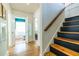 Hallway featuring hardwood floors, staircase, and doorway into bathroom and bedroom at 588 Oakdale Ne Rd, Atlanta, GA 30307