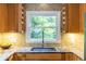 The kitchen has bright wooden cabinets and granite countertops, with a window view of the outdoors at 588 Oakdale Ne Rd, Atlanta, GA 30307