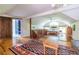 Spacious living room with hardwood floors, large rug, with an open bedroom loft area at 588 Oakdale Ne Rd, Atlanta, GA 30307