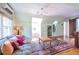 Inviting living room featuring a comfortable couch, hardwood floors, and large windows at 588 Oakdale Ne Rd, Atlanta, GA 30307