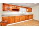 Spacious kitchen with wood cabinets, granite countertops and hardwood floors at 6316 Rockland Rd, Lithonia, GA 30038