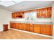 Spacious kitchen with wood cabinets, granite countertops and hardwood floors at 6316 Rockland Rd, Lithonia, GA 30038