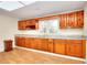 Spacious kitchen with wood cabinets, granite countertops and hardwood floors at 6316 Rockland Rd, Lithonia, GA 30038