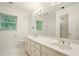This bathroom features a double sink vanity, shower, and toilet at 1256 Spring Park Sw Dr, Atlanta, GA 30311