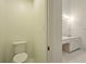 Half-bathroom connected to the primary bathroom with a toilet and vanity at 1256 Spring Park Sw Dr, Atlanta, GA 30311
