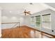 Bedroom featuring hardwood floors, a ceiling fan, and multiple windows providing natural light at 1256 Spring Park Sw Dr, Atlanta, GA 30311