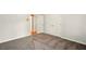 This bedroom offers soft carpeting and an entry door to another room at 1256 Spring Park Sw Dr, Atlanta, GA 30311