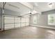Spacious two car garage with garage door opener and windows for natural light at 1256 Spring Park Sw Dr, Atlanta, GA 30311