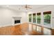 Living room features a fireplace, hardwood floors and French doors leading to a private balcony at 1256 Spring Park Sw Dr, Atlanta, GA 30311