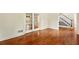 Bright living room featuring gleaming hardwood floors, French doors and a staircase at 1256 Spring Park Sw Dr, Atlanta, GA 30311